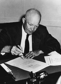 September 9, 1957 - Dwight D. Eisenhower signs the Civil Rights Act of 1957 in his office at the naval base in Newport, Rhode Island.